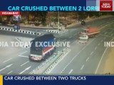 These chilling visuals of car crushed between two trucks will