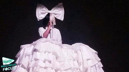 Sia Hides Her Face and Wears Huge Ruffled Dress At Festival