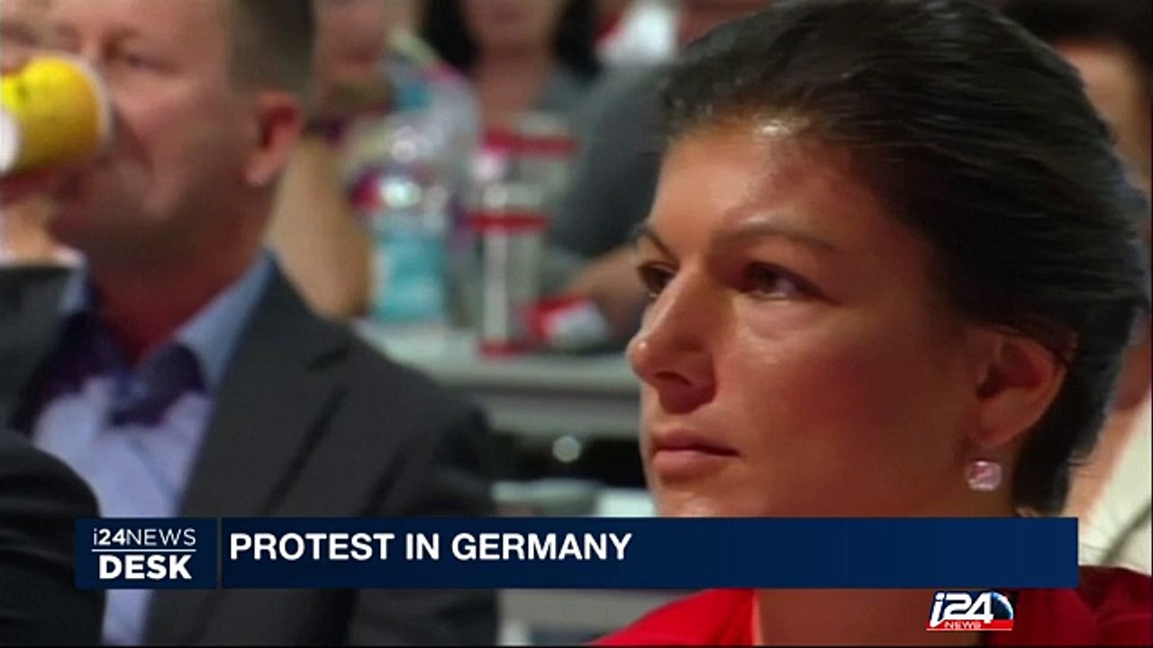 Far-left German PM hit with cream pie in protest at stance on refugees