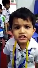 Cute Boy Singing in class in front of teacher