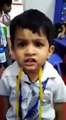 Cute Boy Singing in class in front of teacher