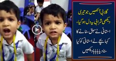 Cute Boy Singing in class in front of teacher