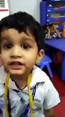 Cute Boy Singing in class in front of teacher