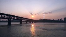 SUNSET OVER THE YANGTZE RIVER IN WUHAN CITY