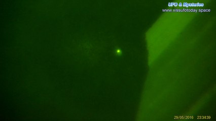 Bright UFO flying above the clouds