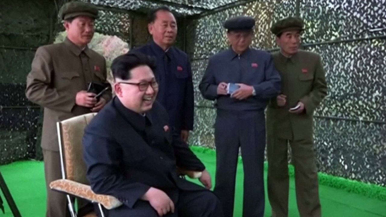 Kim Jong-un laughs and jokes watching military weapon tests
