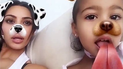 Kim Kardashian and North playing with snapchat effetcts