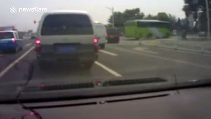 Three children drop out of minibus boot as it pulls away at traffic lights