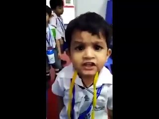 Cute Kid Singing in class in front of teacher