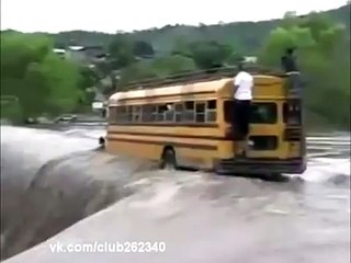 Yellow School Bus of kids parking in flood water falling