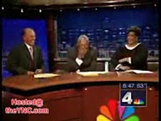 News reader cannot stop laughing at model falling over!