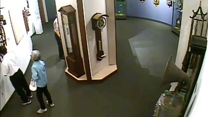 RAW Man ignores museum rules touches priceless Clock who falls from wall and smashes(1)