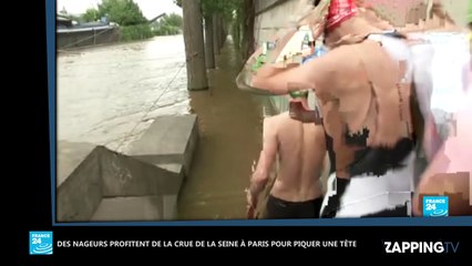 Crue à Paris : Des nageurs font des longueurs dans la Seine (Vidéo)