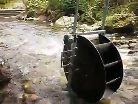 A permanent magnet alternator that's built in with the waterwheel generates free electricity
