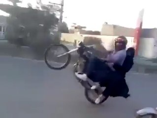 Boy wheeling on Bike with his Girl Friend