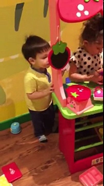 Lucas Eli borrowing little girl's toys hehe