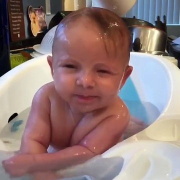Adorable Baby Enjoys Bathtime