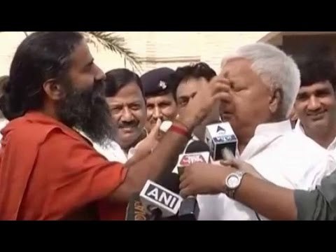 Ramdev applies cream on Lalu Yadav