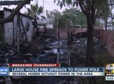 Four people displaced after house fire spreads to power pole