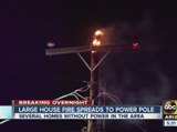 Large house fire spreads to power pole, several homes without power Sunday morning