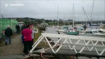 Australian yacht club marina collapses during heavy rains and flood tides