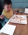 Baby eating fish n chips