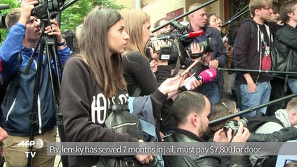 Russian court frees artist with fine for torching FSB's door