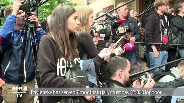 Russian court frees artist with fine for torching FSB's door