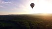 Stunning drone footage of hot air balloons before sunset