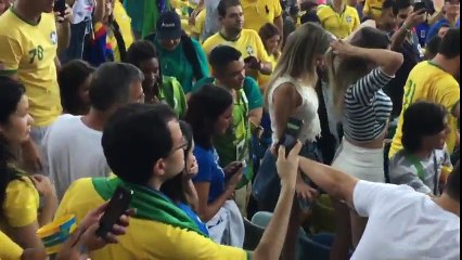 Neymar hugging his girlfriend Bruna in the crowd after the win