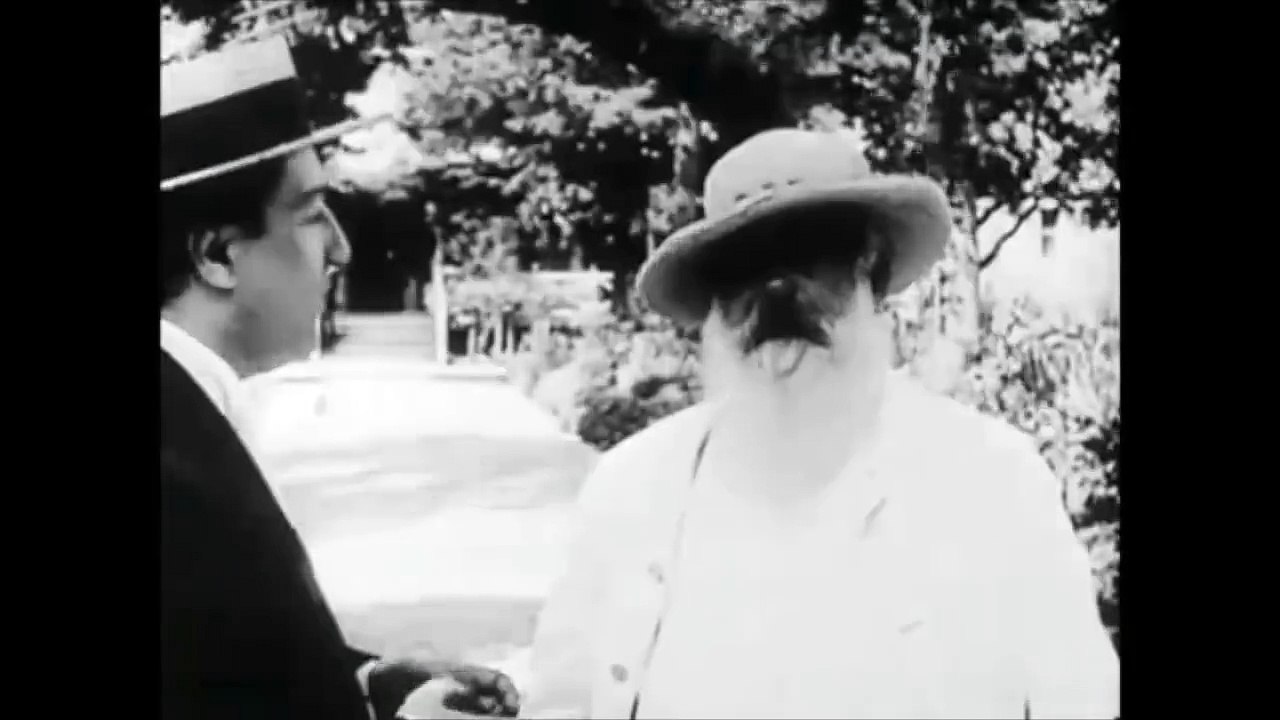 Claude Monet painting 'en plein air', in his flower garden at Giverny (1915)