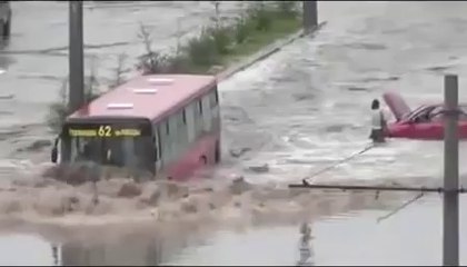 Bus Drives Through Flooded Street - Cool