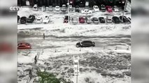 Footage Heavy rain and hail turn streets into rivers in NE China