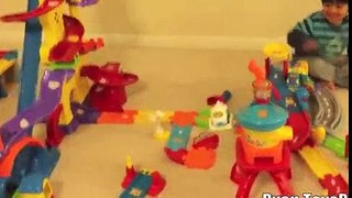 Kid playing with toys Vtech Go Go smart wheels review amazement park train station 2