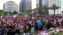 Candles, tears and song at Orlando vigil for massacre victims