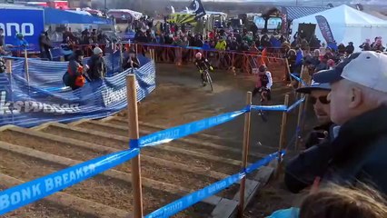 Cyclist rides up steps during race.