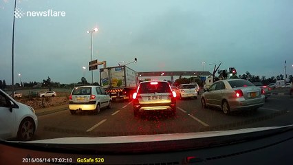 Dozens of balloons fly off car on busy road