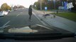 woman for helping the Canada Geese and their goslings cross the road.