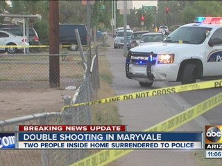 Two people detained after double shooting