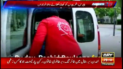 Muslim man offers food to poor in Paris during Ramazan