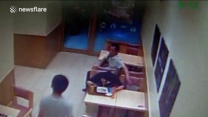 Man steals woman's while she plays on phone