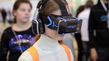 Boy uses virtual reality game development kit FIBRUM (virtual reality glasses)
