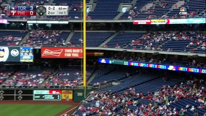 Fan grabs foul ball while holding his child