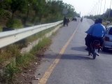 Police man with out helmet and vehicle number on the road in Islamabad Reporting by PCCNN Chaudhry Ilyas Sikandar