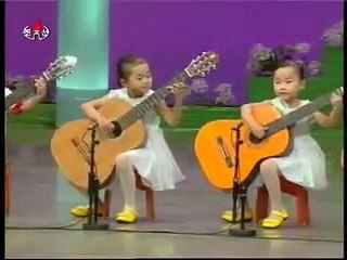 Children playing the guitar