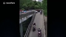 Car drives onto pedestrian bridge and nearly gets stuck