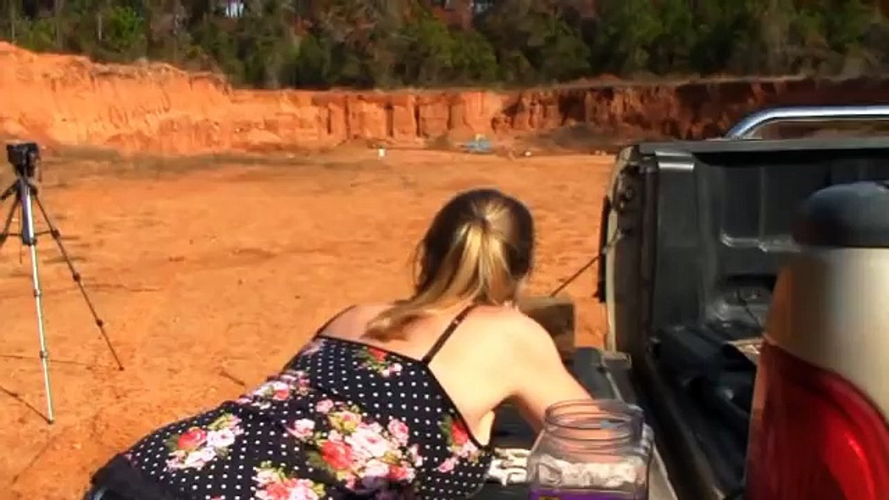Girl With Gaps And Cracks Filler Shooting A Big Rifle