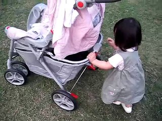 Pushing my stroller and walking in the grass March 10, 2007
