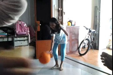 Kid playing basketball like pro Kobe Bryant