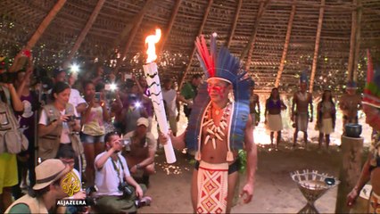 Amazon tribe gives Rio Olympic torch a traditional welcome